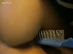 Brave eighteen year old slutty wife uses a blue spiked hairbrush for insertion pleasure during the time that on livecam